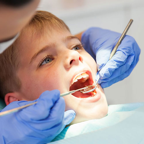 Boy having dental fillings