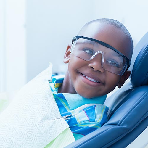 Boy smiling before his new patient exam