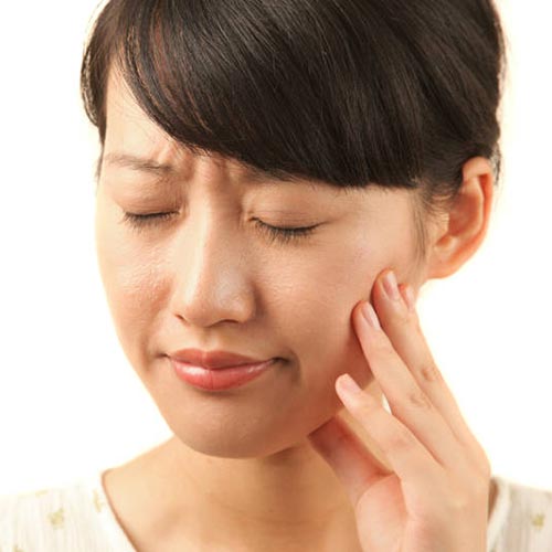 Girl in pain before tooth extraction