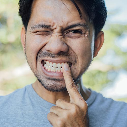 Man in pain before root canals