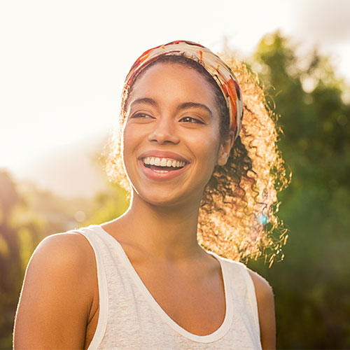 patient smiling outside after having dental bonding