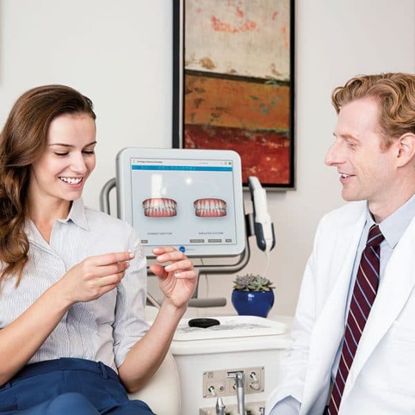 woman looking at her future smile and bite generated byAI from  iTero digital scanner 