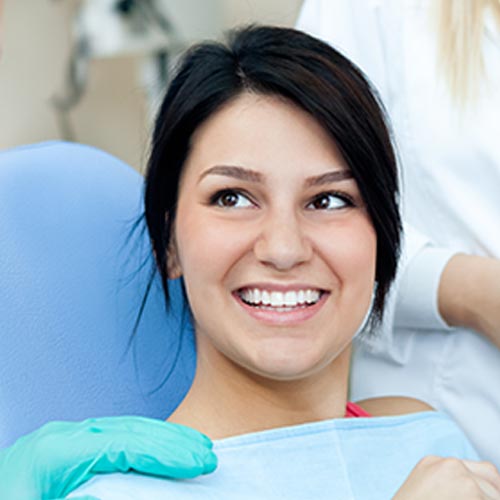 woman smiling before dental hygiene appointment